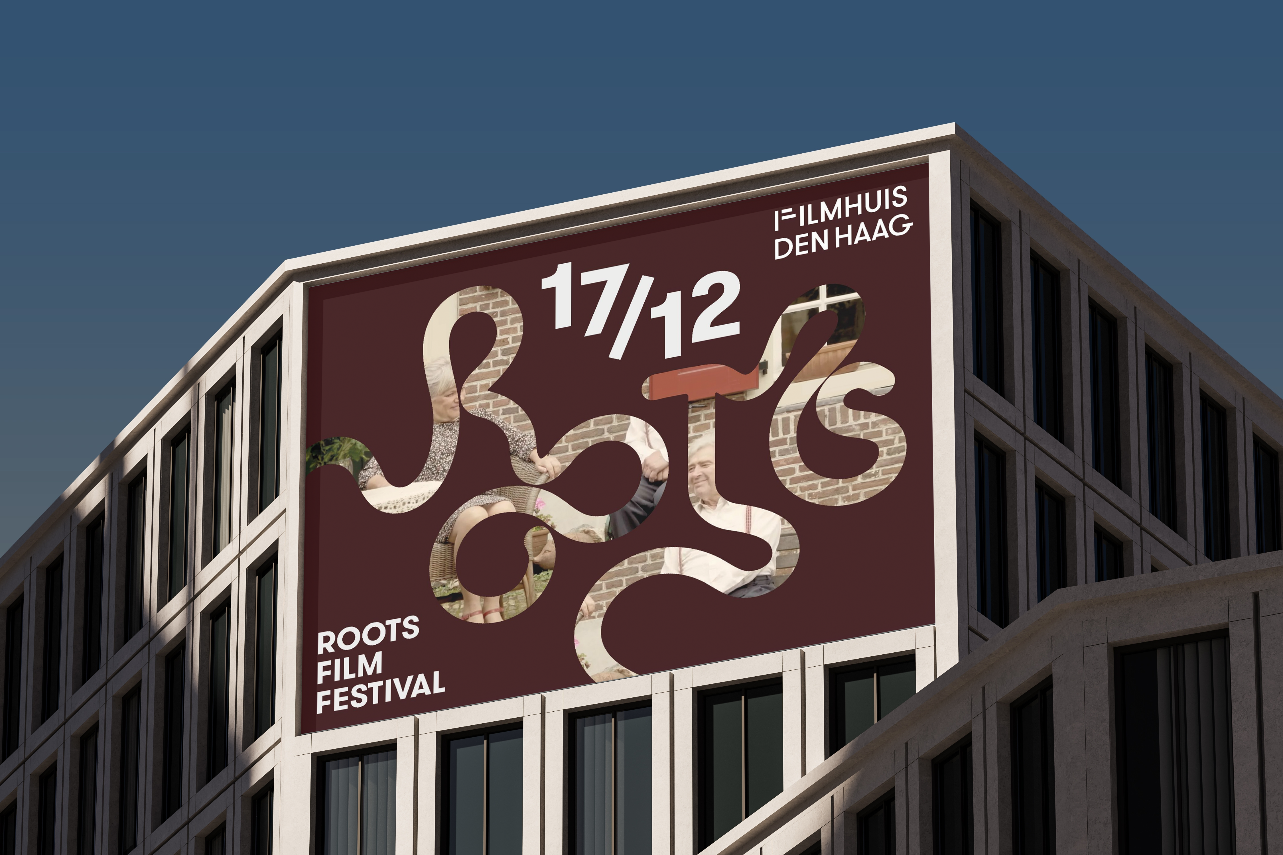 ROOTS Film Festival banner on a building facade